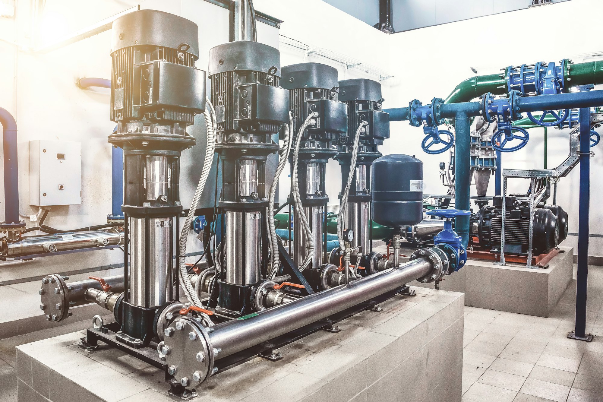 Industry pumps in an technical room.Industrial interior of water pump, valves, pressure gauges